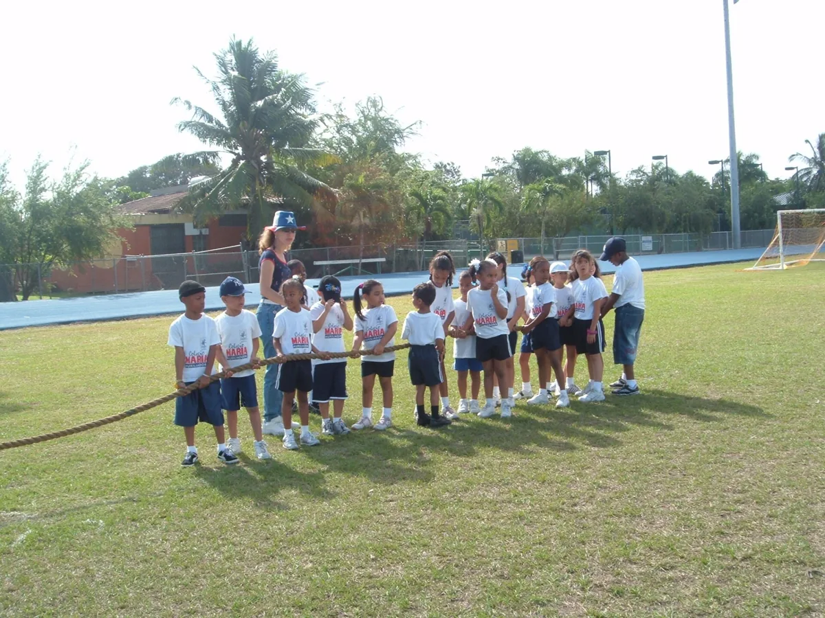 Students participating in an outdoor school activity on the athletic field